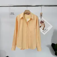 C336秋季纯色拼接休闲风印染翻领黄色上衣长袖衬衫XFJ