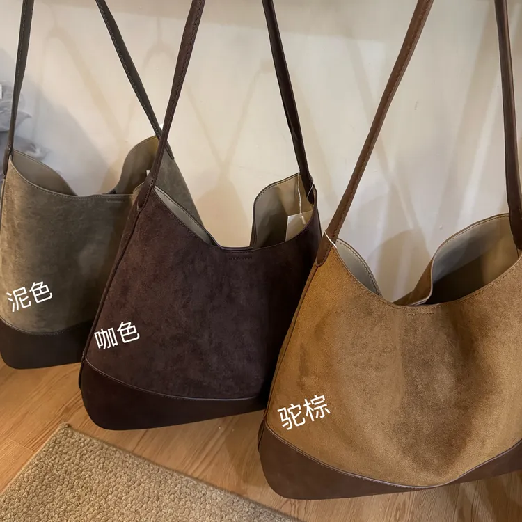 防刮简约风单肩包编织单根水桶包磁扣托特包耐磨