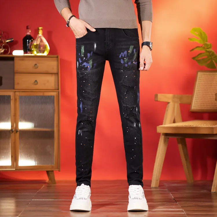 秋季新款男士牛仔裤黑色泼墨假破洞修身小脚长裤弹力休闲九分裤子