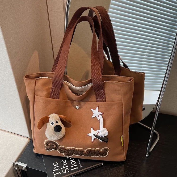 秋冬帆布包女大容量托特包休闲通勤卡通学生单肩手提袋轻便妈咪包