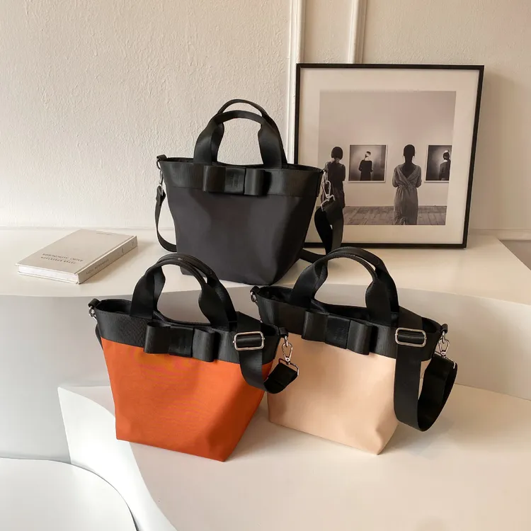 尼龙布包包女大容量2025新款跨境百搭宽带斜挎包高级感手提水桶包