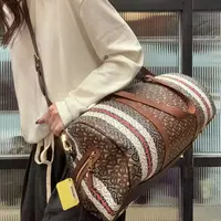 95新 BURBERRY/博柏利 【蕾】03 1214 棕色满印字母印花大号旅行袋