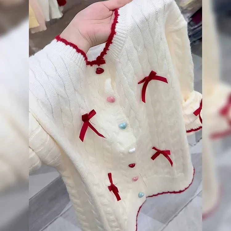 韩版立体蝴蝶结多巴胺纽扣针织衫2025秋季女装千金清冷感贵系衣服