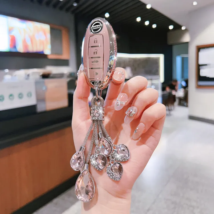 适用于日产钥匙套轩逸逍客汽车壳天籁奇骏劲客骐达蓝鸟楼兰扣包女