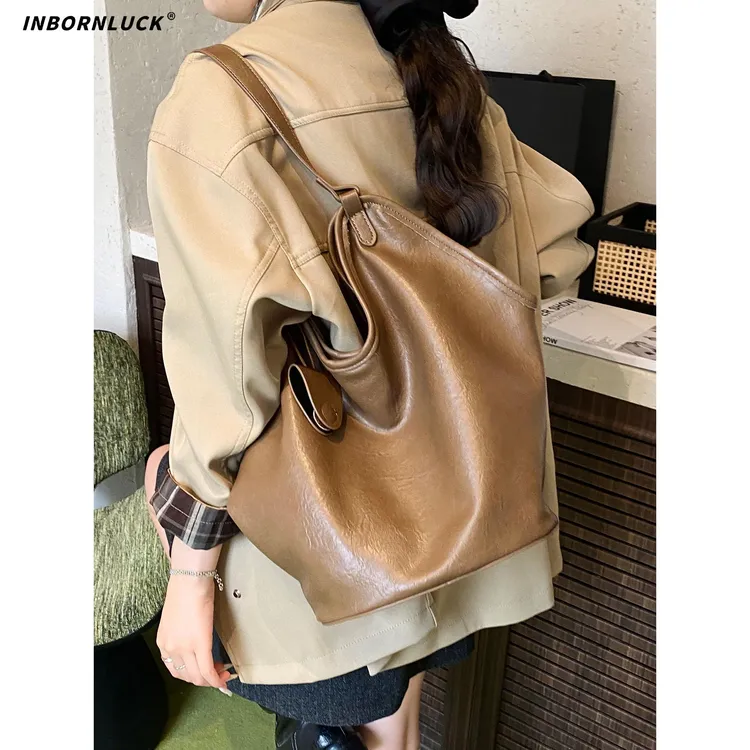 简约休闲水桶包包2025新款大容量秋季百搭韩版ins高级感单肩包