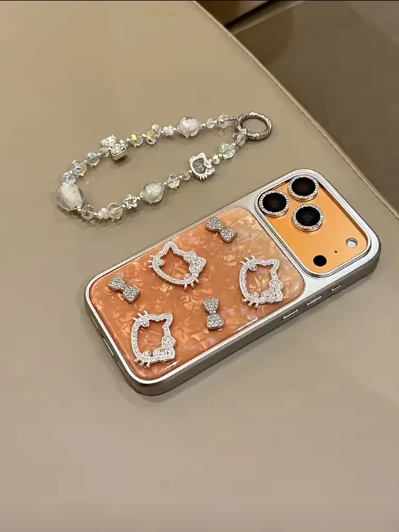 小众滴胶贝壳纹橙色闪钻kt猫适用iPhone17pro手机壳苹果16pro新15