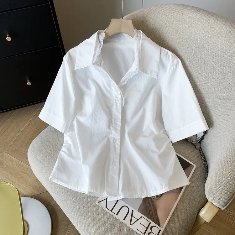 夏季高级感蕾丝拼接蓝色衬衫2025新款超好看花边独特宽松显瘦上衣