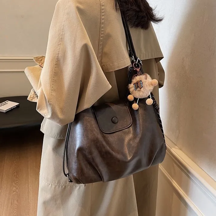 多功能大容量包包女2025秋冬新款单肩包复古斜挎包通勤双肩云朵包