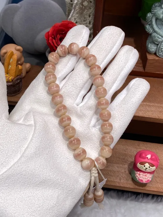 No.737驼骨三花千层圆珠手持（图片为两种光线效果）