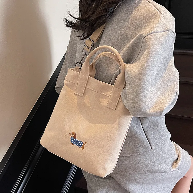 休闲帆布包包女2025新款腊肠狗托特包学生上课大容量手提包斜挎包
