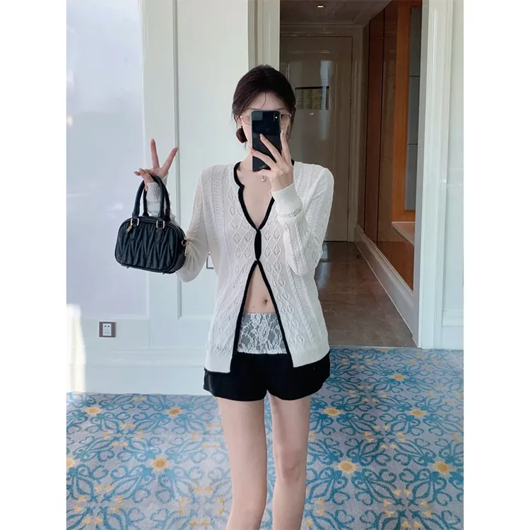 2025早秋新款纯欲纽结针织开衫长袖上衣女蕾丝拼接假两件百搭短裤