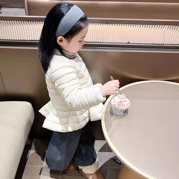 儿童2025冬季新款中小童休闲韩版纯色米色花边裙摆棉服外套