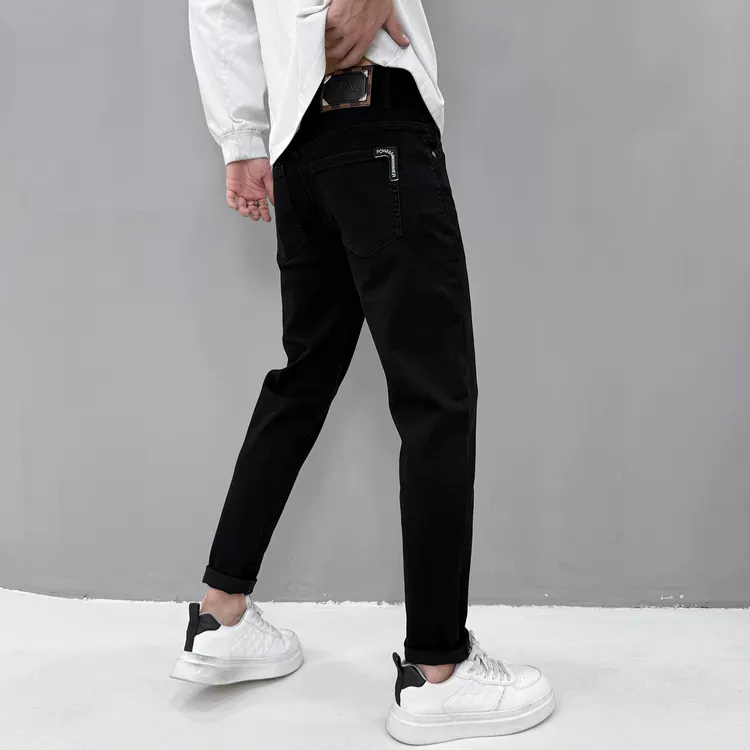 纯黑色牛仔裤男款2025新款冬季轻奢潮牌修身小脚显瘦潮流百搭长裤