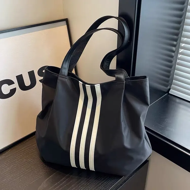 手提单肩牛津布包女2025新款大容量学生通勤托特包简约百搭手拎袋