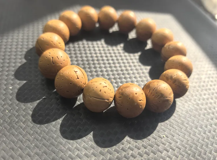 盘锦桃核苹果圆光珠手串