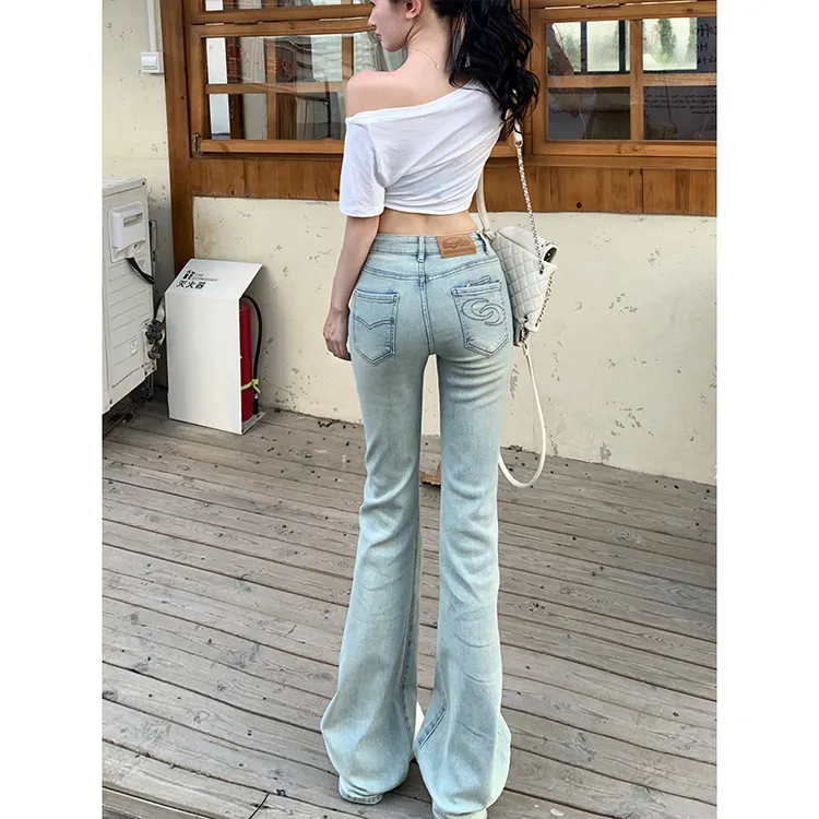浅色刺绣弹力牛仔微喇裤女2025秋季新款低腰修身显瘦美腿拖地长裤