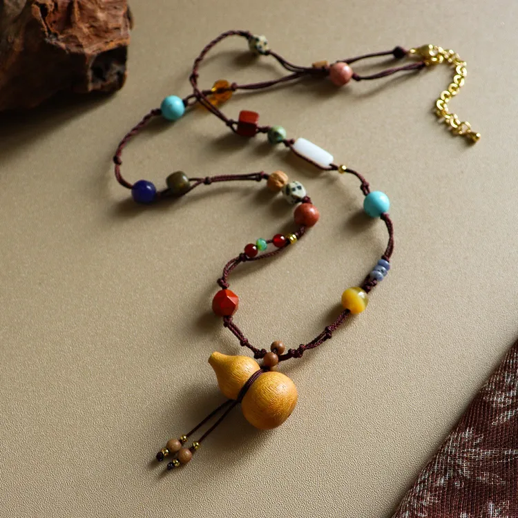 秋冬复古精致檀木葫芦长项链配饰女轻奢小众高级感编织毛衣吊坠链