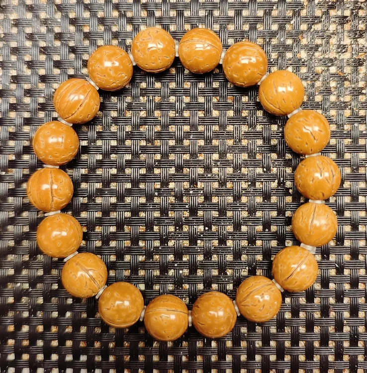 12尺寸精品野生红皮桃核光珠手串 送手套线轴