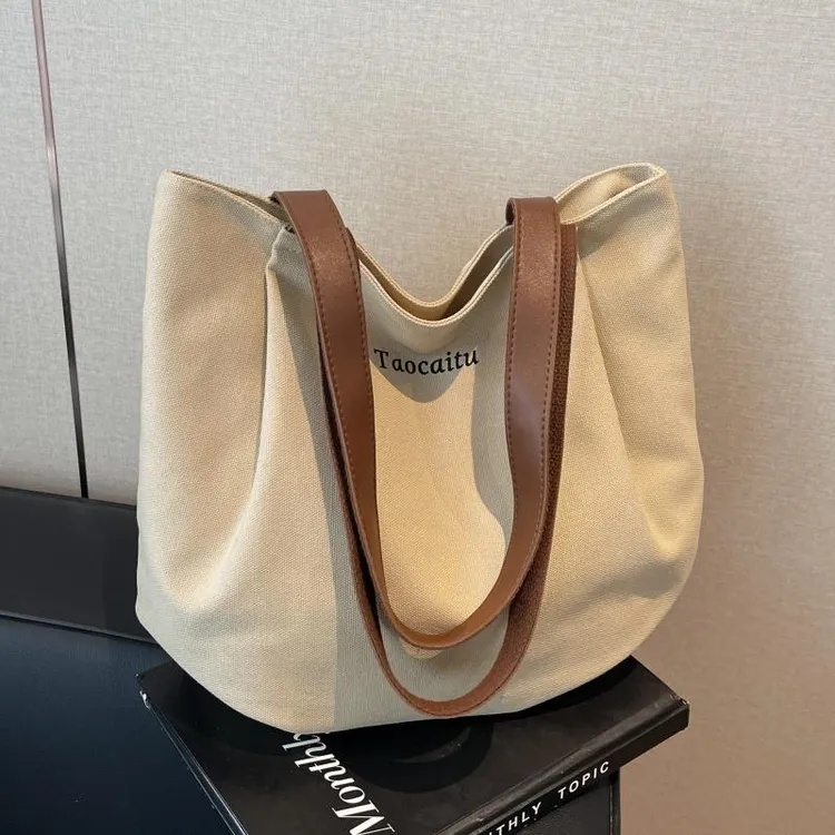 简约休闲帆布包包女2025新款通勤单肩托特包小众百搭大容量手提袋