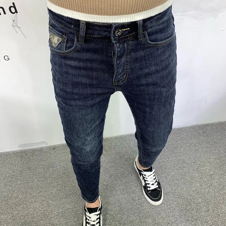 男牛仔裤冬季薄绒潮牌痞帅修身小脚裤水洗蓝色潮流刺绣微垮哈伦裤