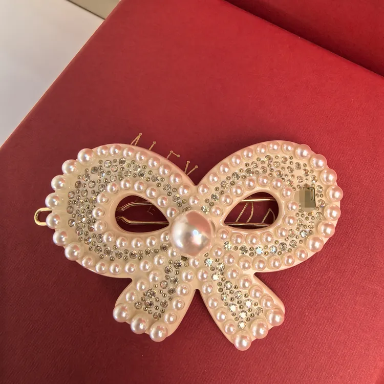  向往珍珠蝴蝶结边夹闪醋酸高级感碎发刘海夹
