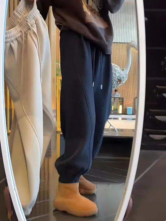 黑色加绒束脚卫裤女2025冬季新款大码梨形身材显瘦宽松九分哈伦裤