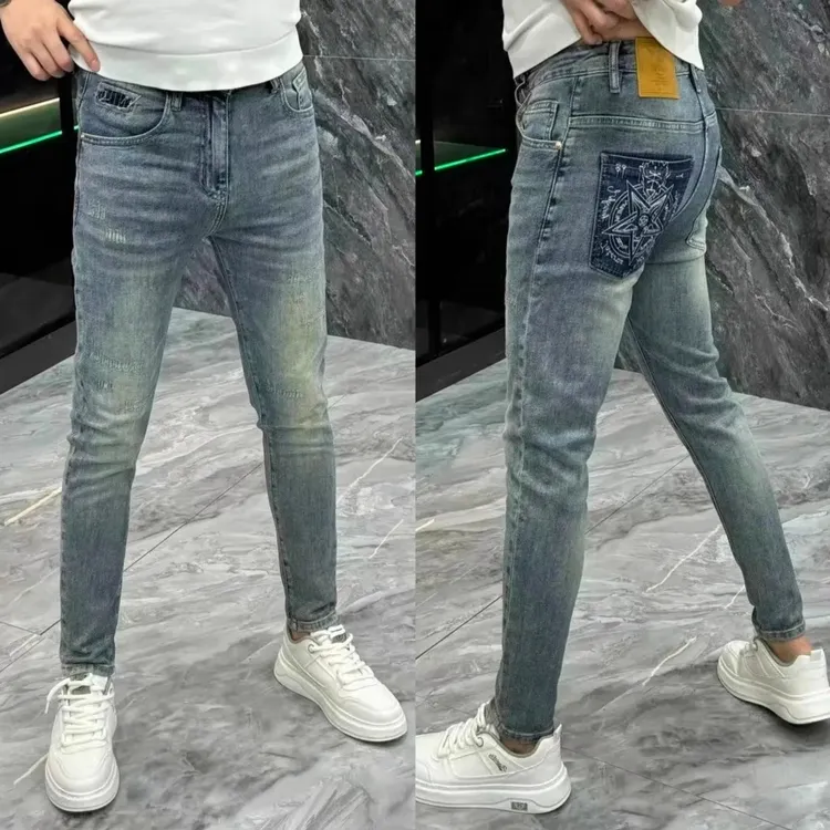 潮牌痞帅复古弹力长裤子男2025新款高端破洞牛仔裤男士修身小脚裤