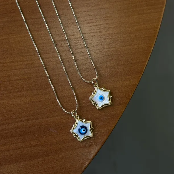 钛钢贝壳吊坠 GULUM 976 星星吊坠蓝眼睛两种颜色蓝色轻奢