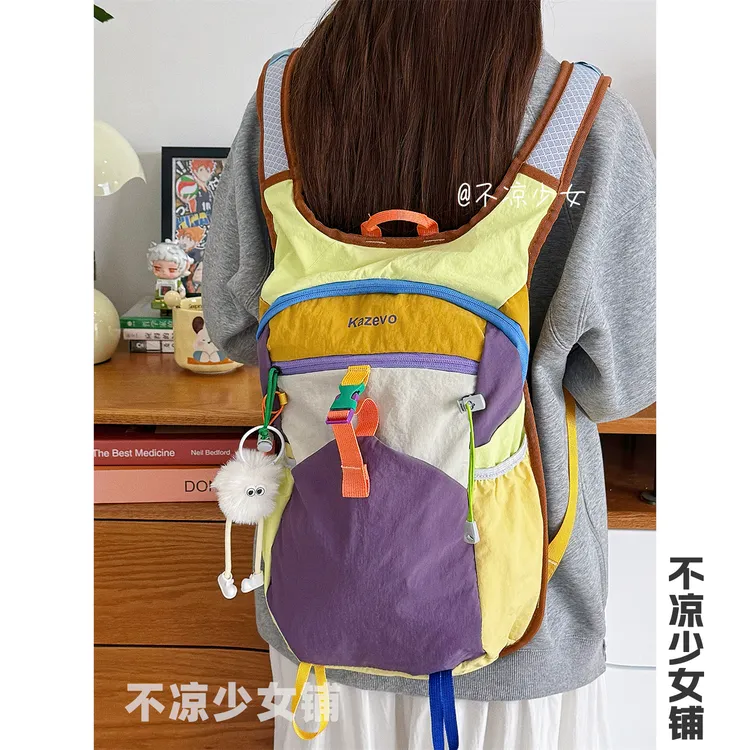 多巴胺撞色小众运动轻便书包学生防水双肩包户外徒步登山旅行背包