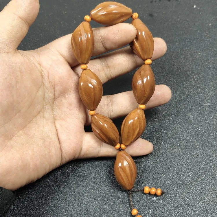 精品素核打磨雕刻扭转乾坤尺寸：1.8×3.0左右橄榄核手串文玩手串