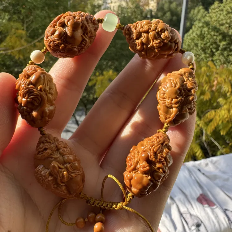 橄榄核核雕尺寸20骑兽达摩手工文玩手串（有瑕疵有小眼）