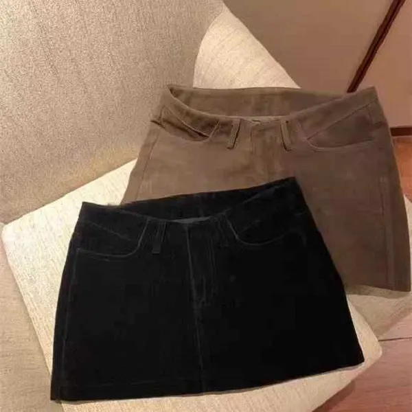 设计感鹿皮绒弧形腰短裙自带安全裤女气质百搭高腰显腿长半身裙