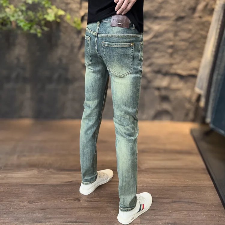 2025年秋冬男款牛仔裤网红修身弹力复古黄泥染小脚痞帅潮男长裤子