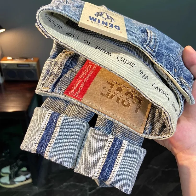 橡筋刺绣牛仔裤男春秋款九分裤高端潮流浅蓝色弹力修身小脚长裤