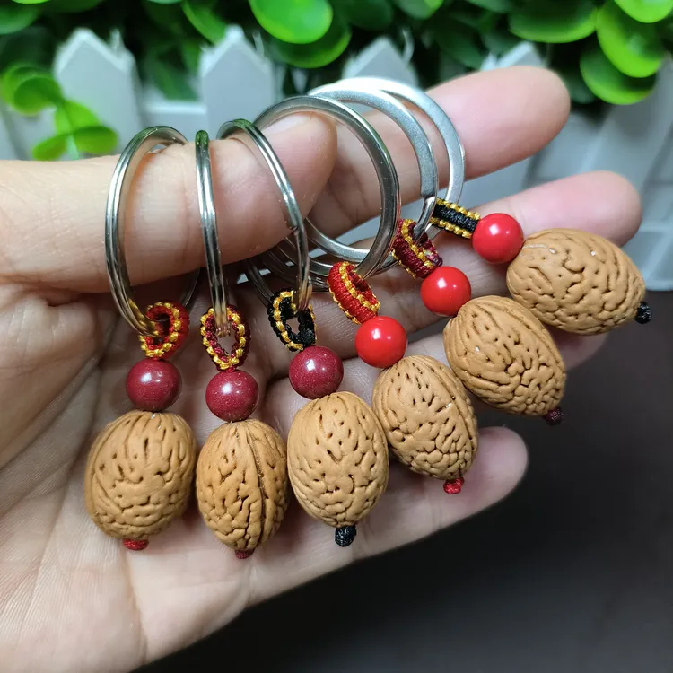 钱袋子野生脑纹山桃核编织平安朱砂男女随身手机链钥匙扣创意挂饰