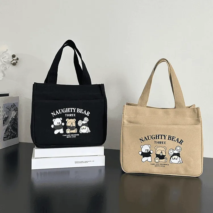 拉链外侧兜帆布手提包多口袋妈咪包学生便携饭盒包通勤女包大容量