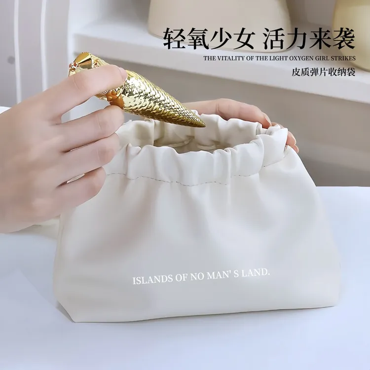 轻奢皮质化妆包小众口红收纳袋随身百搭零钱包包自动闭合弹片小包