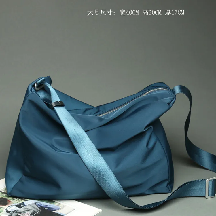 轩唯无性别斜挎包男大容量休闲运动帆布旅行单肩包女简约防水新款