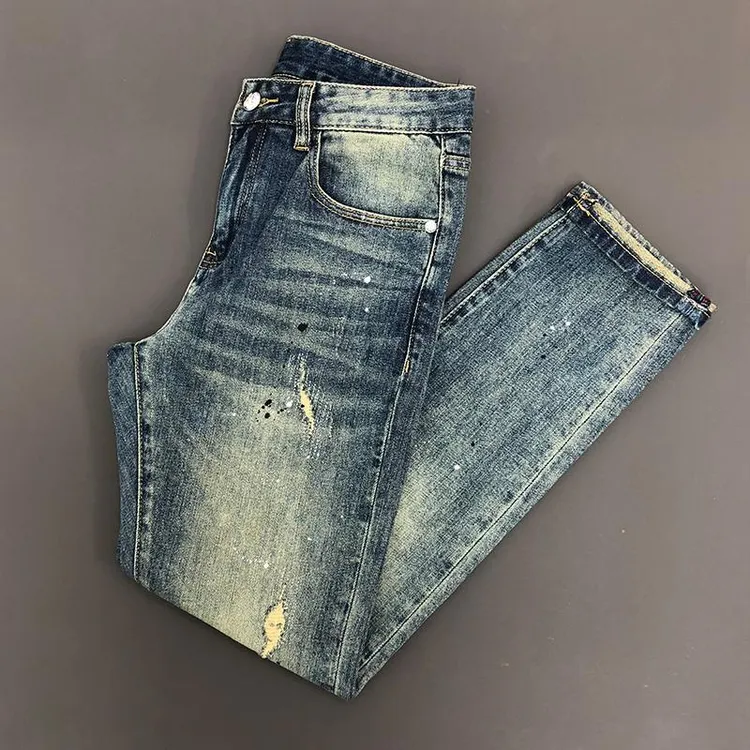 破洞泼漆牛仔裤潮牌复古怀旧黄金属装饰修身裤子小脚弹力男装长裤