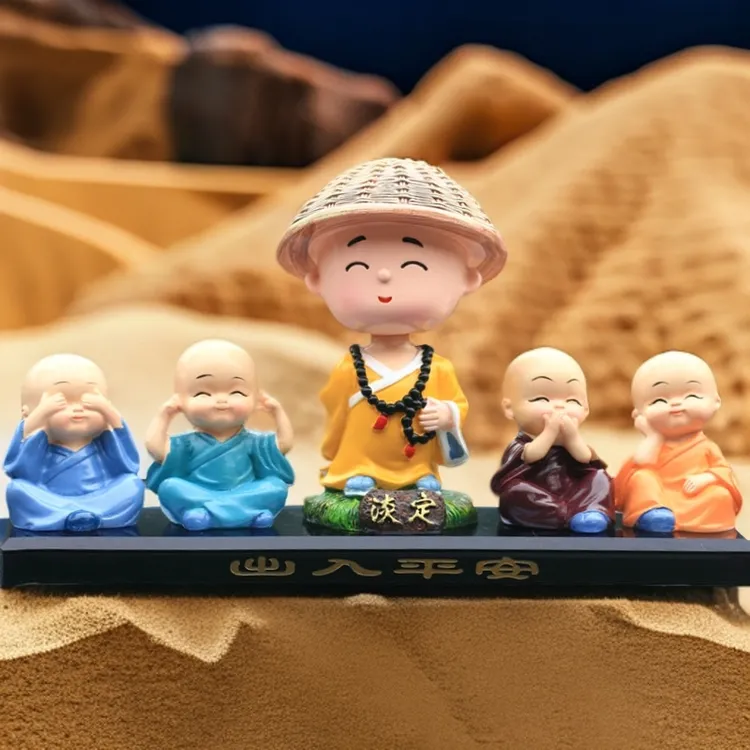 创意小沙弥汽车中控台香水座摆件车载树脂摇头小和尚车内装饰用品