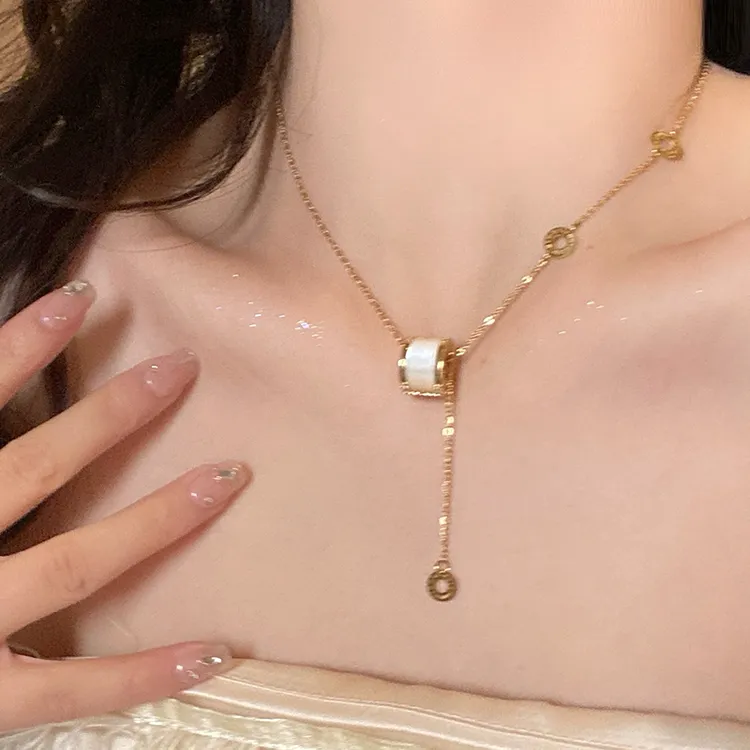 钛钢项链 猫眼石小蛮腰流苏项链高级感轻奢小众项链女坠链毛衣链