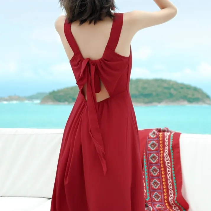 巴厘岛海滩裙沙滩裙女超仙三亚海边度假性感露背酒红色吊带连衣裙