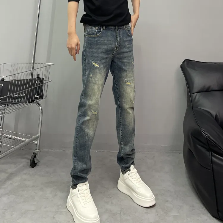 早秋新款高端男士潮牌复古水洗蓝潮流假破洞休闲高弹力修身牛仔裤