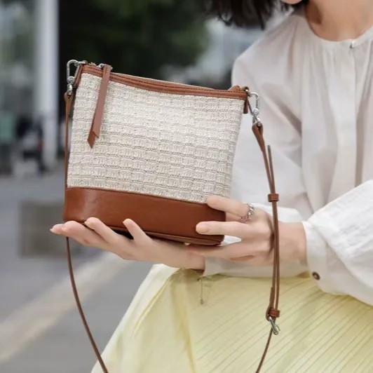 2025新镂空女包简约休闲水桶包文艺小众单肩编织包撞色轻便斜挎包