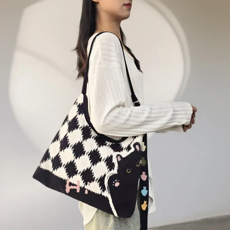 尼睿新款原创哈喽煤球新月加侧斜挎时尚百搭单肩大容量小众休闲女