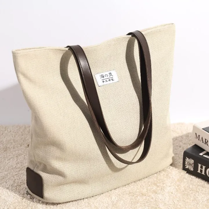 布包女新款棉麻帆布包简约百塔单肩手提女包复古托特包学院风包包