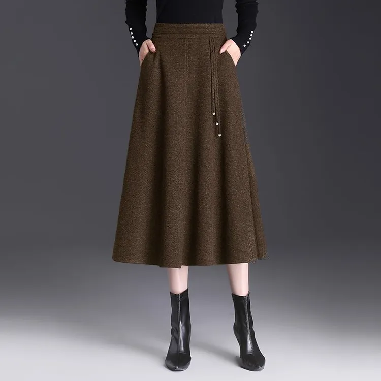 新中式半身裙女秋冬2025新款高腰黑色毛呢中长款中国风大摆a字裙