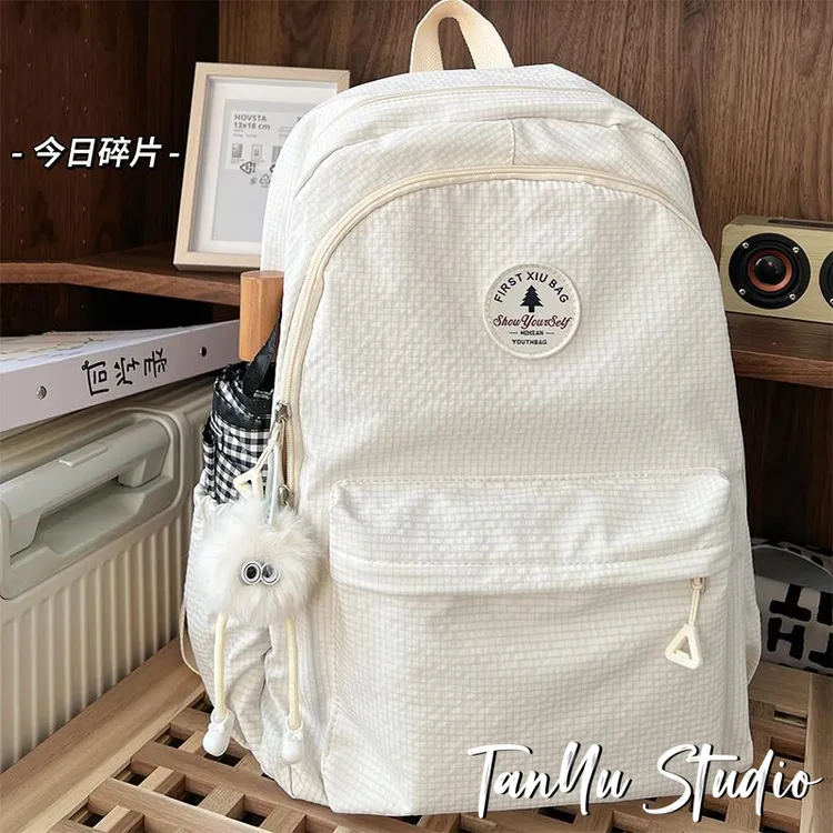 探屿大容量书包女生初中小众设计感大学生纯色高中生简约双肩包