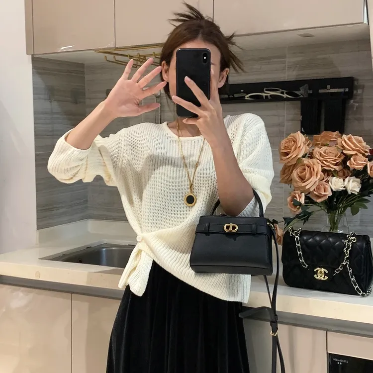 韩系设计感下摆提扣针织衫女秋季新款百搭简约休闲纯色毛衣T9448