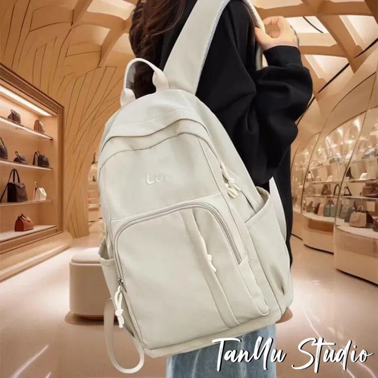 探屿潮牌时尚护脊双肩包大容量高中生初中生书包女减负小学生背包